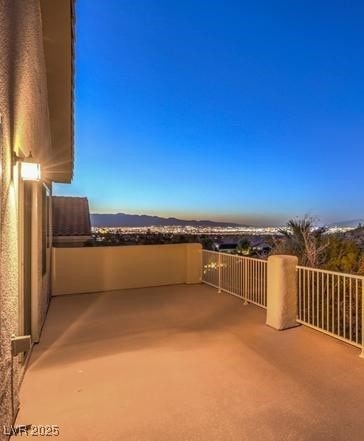 view of patio featuring a balcony