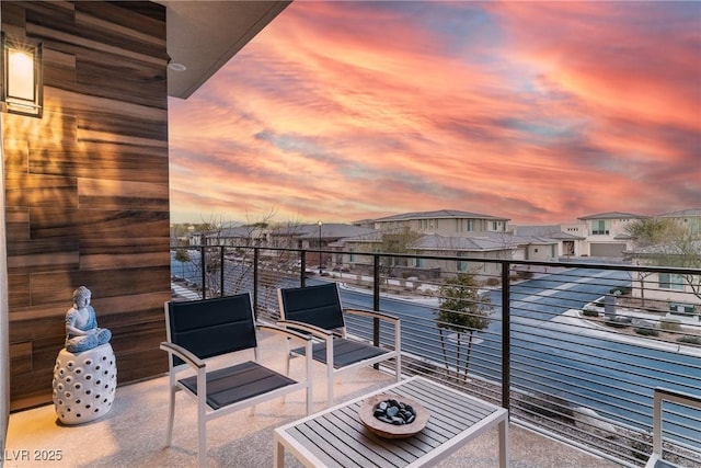 balcony at dusk with a residential view