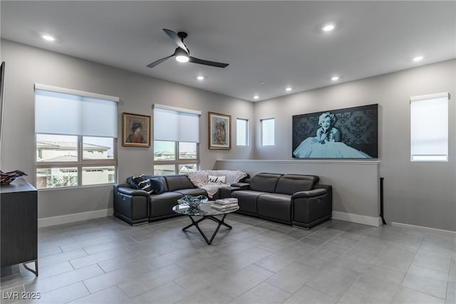 living area with ceiling fan, baseboards, and recessed lighting