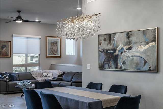 dining room with ceiling fan and wood finished floors