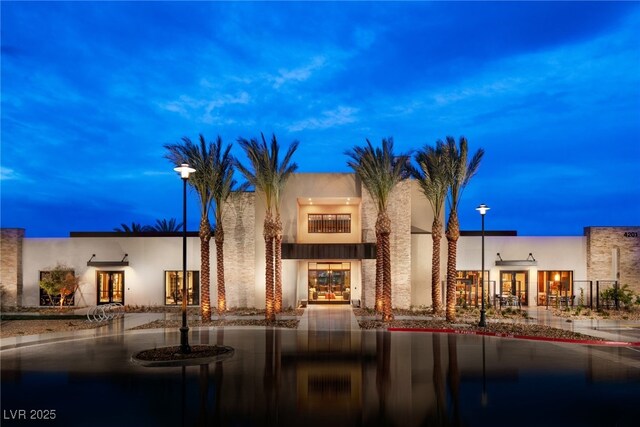 view of outdoor building at dusk