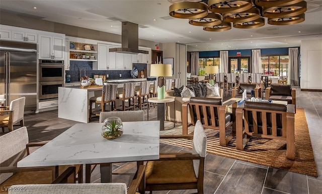 dining space featuring recessed lighting and wood finished floors