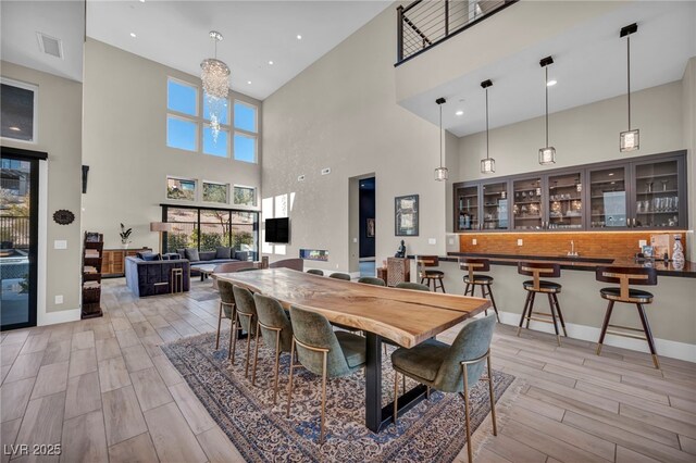 dining room with a notable chandelier and light wood-type flooring