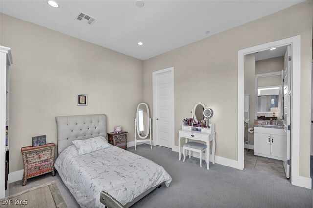 carpeted bedroom featuring sink