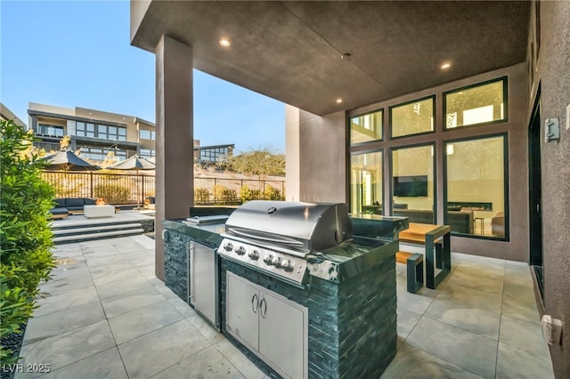 view of patio with area for grilling and grilling area