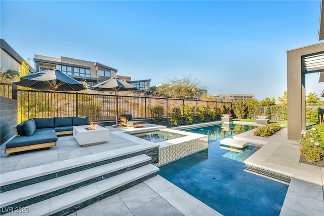 view of pool featuring an in ground hot tub, an outdoor fire pit, and a patio area