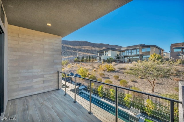 balcony featuring a mountain view