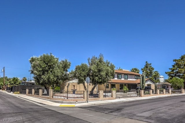 view of front of property with fence and a residential view