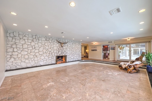 unfurnished living room featuring a stone fireplace, visible vents, and recessed lighting