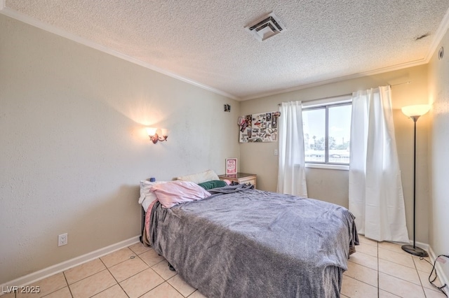 bedroom featuring ornamental molding, visible vents, a textured ceiling, and baseboards