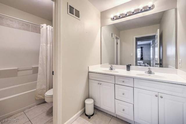 bathroom with tile patterned floors, visible vents, a sink, and ensuite bathroom