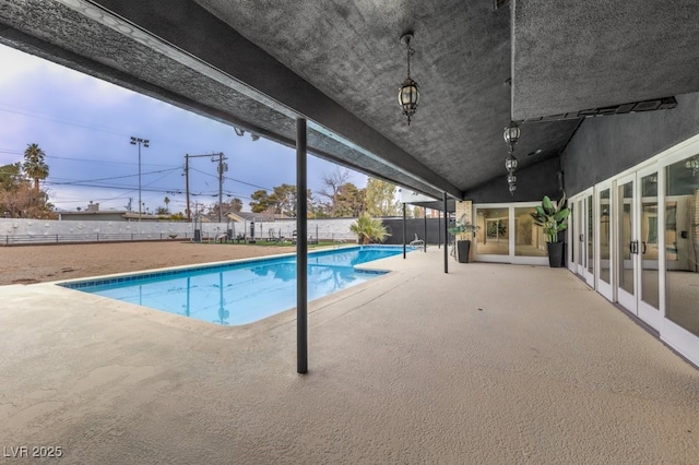 view of swimming pool featuring a fenced backyard, a fenced in pool, and a patio