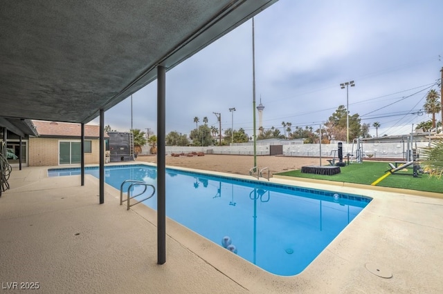 view of pool with fence and a fenced in pool