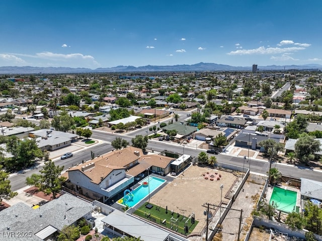 drone / aerial view featuring a residential view and a mountain view