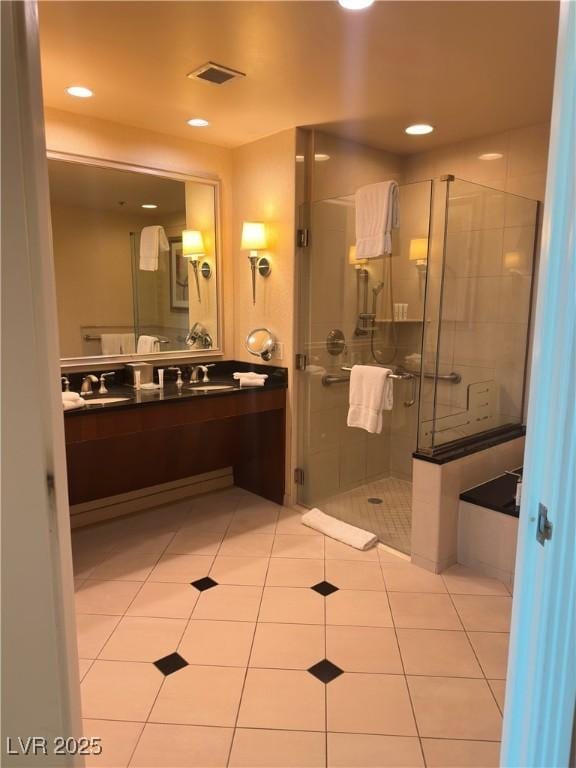 bathroom with vanity, tile patterned floors, and walk in shower