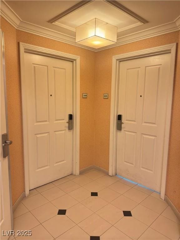 tiled entrance foyer with crown molding