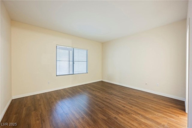 unfurnished room featuring hardwood / wood-style flooring