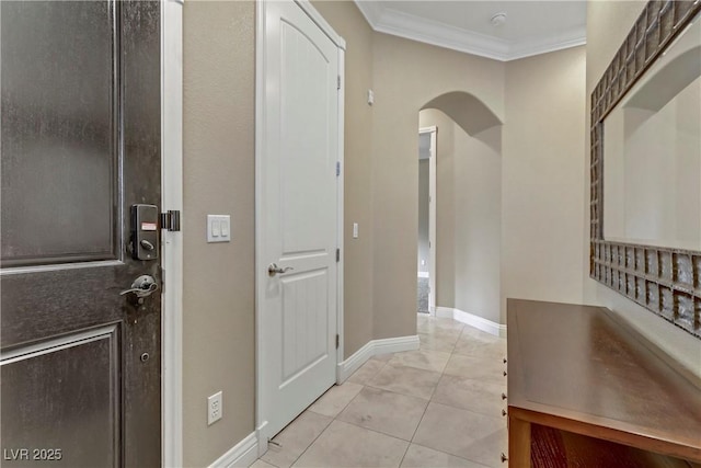 interior space featuring ornamental molding, mail boxes, and light tile patterned flooring