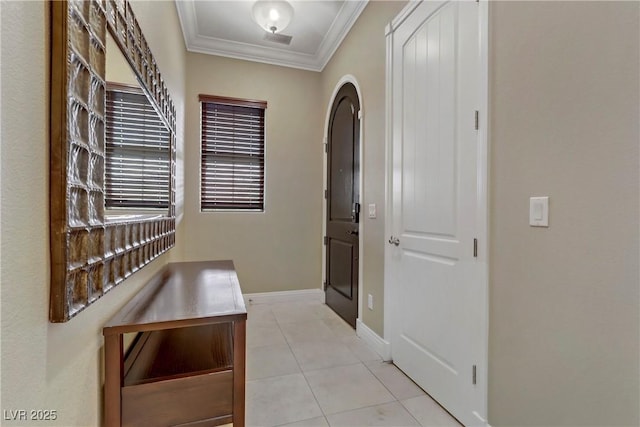 hallway featuring light tile patterned floors and ornamental molding