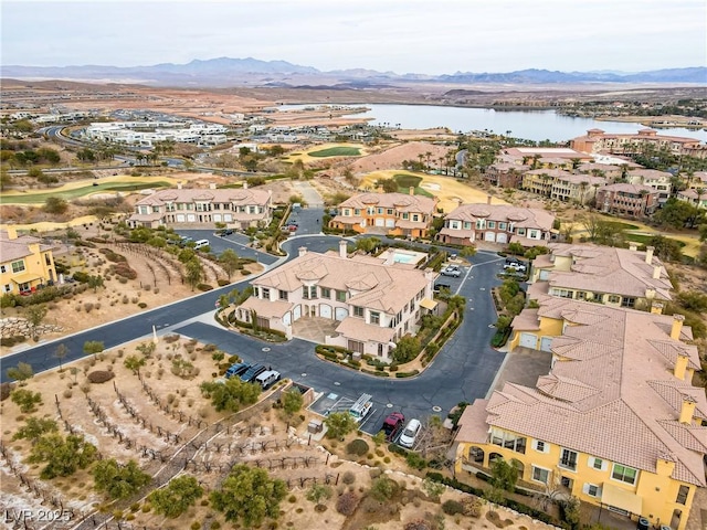 bird's eye view with a water and mountain view