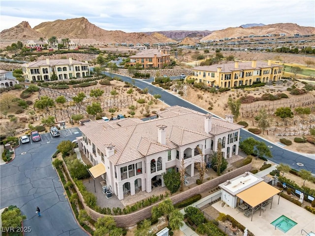 birds eye view of property featuring a mountain view