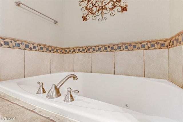 bathroom featuring tiled bath