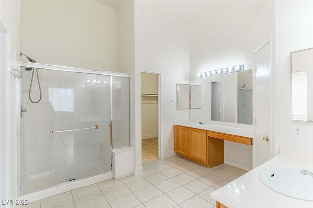 4507 Golden Palomino Ln, North Las Vegas, NV 89032 - bathroom featuring vanity, a stall shower, tile patterned floors, and a spacious closet
