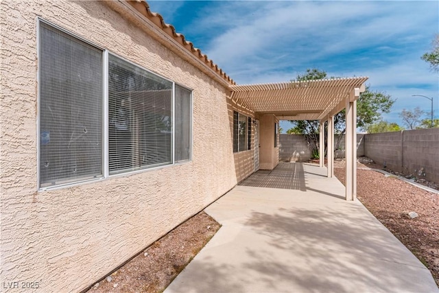 4507 Golden Palomino Ln, North Las Vegas, NV 89032 - fenced backyard with a patio area