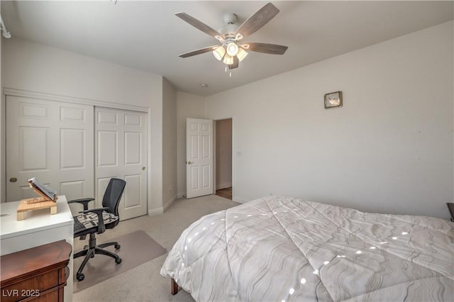 carpeted bedroom featuring a closet and ceiling fan