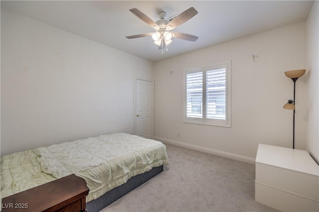 bedroom with ceiling fan and carpet