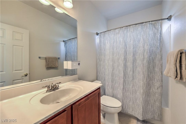 full bathroom with vanity, shower / tub combo, and toilet