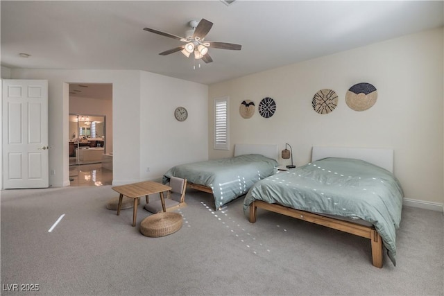 carpeted bedroom featuring ceiling fan and ensuite bathroom