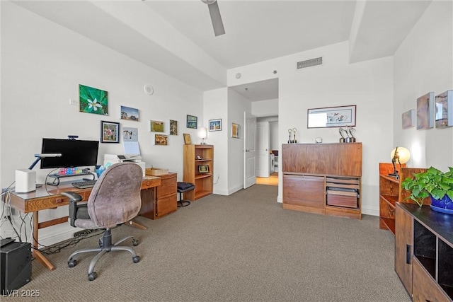 carpeted office with ceiling fan