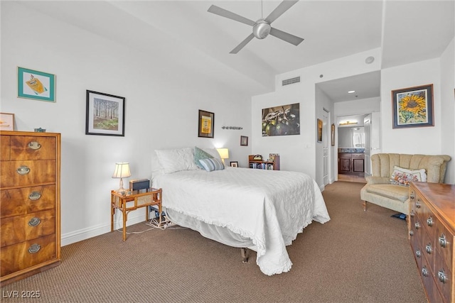 carpeted bedroom with ceiling fan and ensuite bath