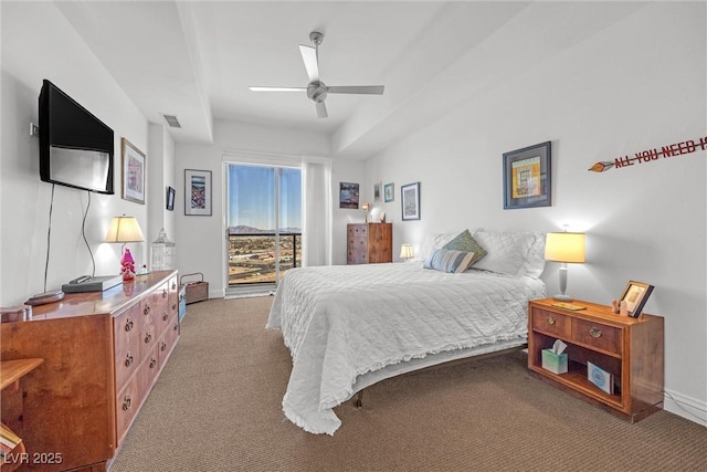 bedroom featuring access to outside, ceiling fan, and carpet