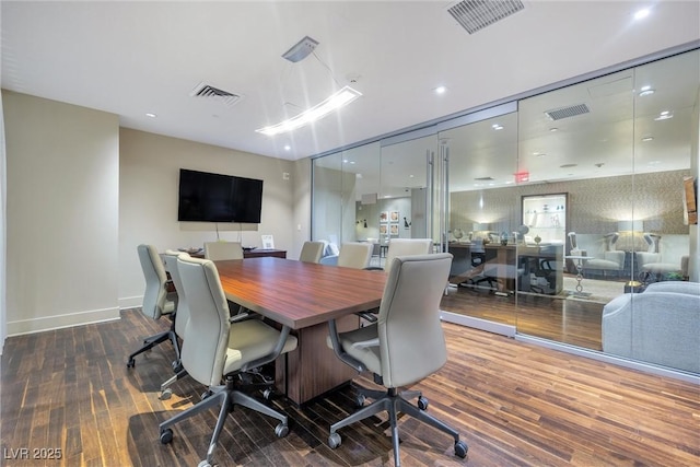 home office with dark hardwood / wood-style floors