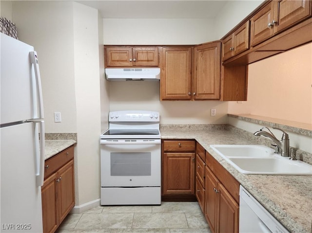 kitchen featuring white appliances and sink