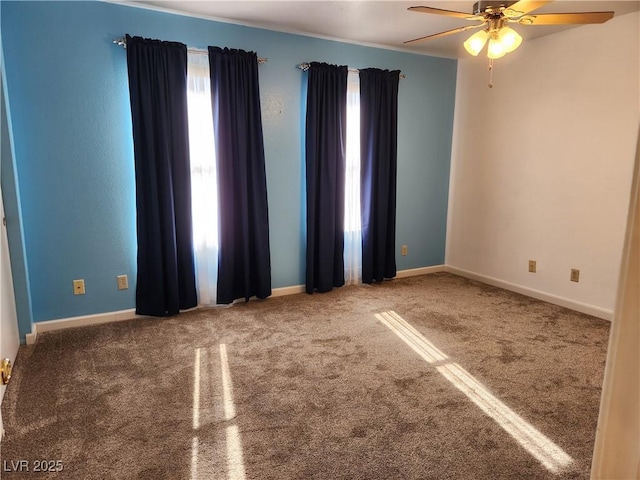 empty room with carpet floors and ceiling fan