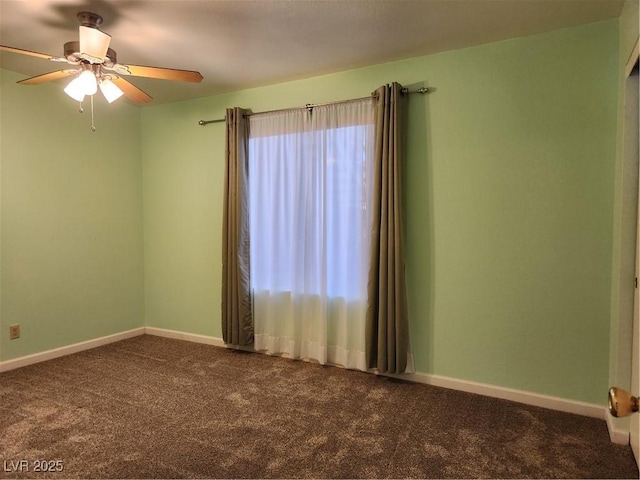 spare room with plenty of natural light, ceiling fan, and carpet flooring