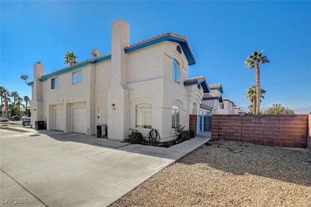 rear view of house featuring a garage