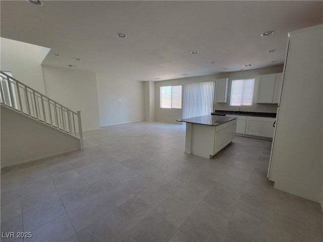 kitchen with white cabinetry and a kitchen island