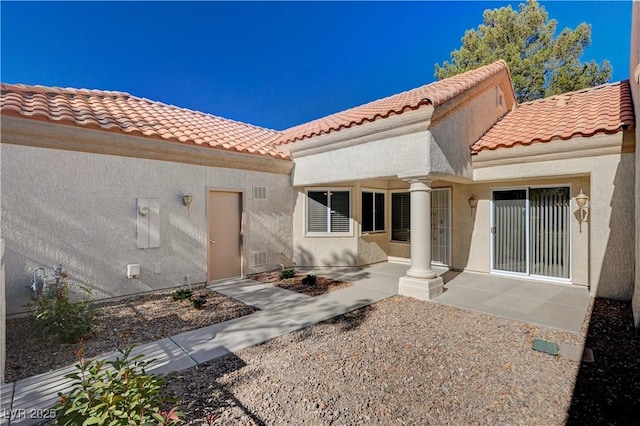 rear view of house with a patio