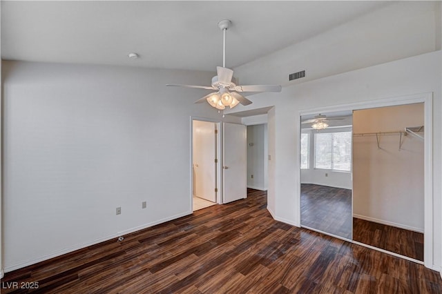 unfurnished bedroom featuring dark hardwood / wood-style floors, ceiling fan, and a closet