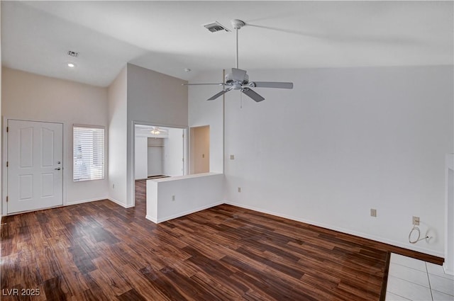 unfurnished living room featuring high vaulted ceiling, dark hardwood / wood-style floors, and ceiling fan