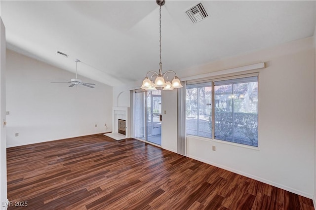 unfurnished dining area with wood-type flooring, lofted ceiling, and ceiling fan with notable chandelier