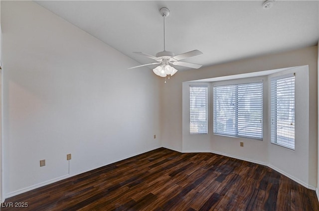 unfurnished room featuring dark hardwood / wood-style flooring and ceiling fan