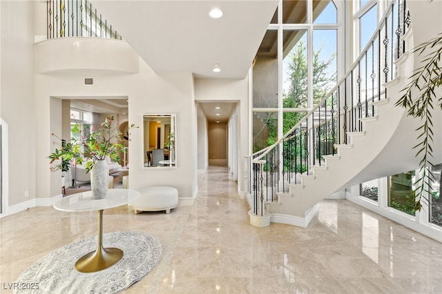 1549 Foothills Village Dr, Henderson, NV 89012 - entrance foyer with stairs, a high ceiling, plenty of natural light, and marble finish floor