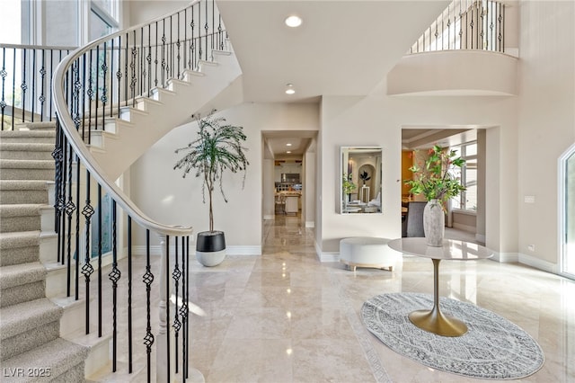 1549 Foothills Village Dr, Henderson, NV 89012 - foyer entrance with a high ceiling, marble finish floor, recessed lighting, baseboards, and stairway