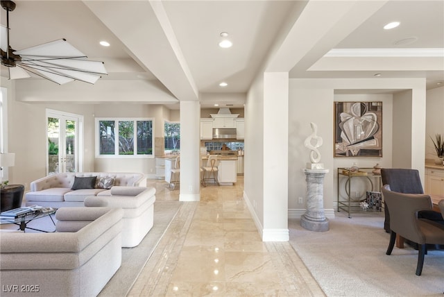 1549 Foothills Village Dr, Henderson, NV 89012 - living area with ornamental molding, marble finish floor, baseboards, recessed lighting, and a raised ceiling