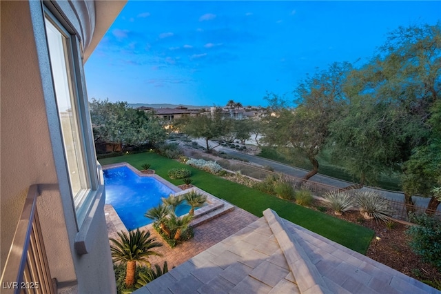 view of swimming pool with a patio area and a lawn